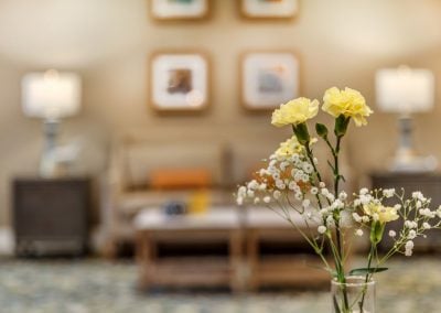 lounge area with fresh floral arrangements